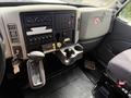 Interior view of a 2011 International 4300 showing the dashboard controls gear shift and cup holders