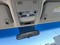 Interior view of a 2013 Chevrolet Silverado 1500 showing the overhead console with light controls and a rearview mirror