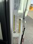 A close-up view of the door panel of a 2017 RAM Promaster showing safety and compliance labels along with various specifications and information.