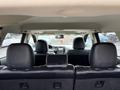 Interior view of a 2016 Mitsubishi Outlander showcasing the back seats and front dashboard details