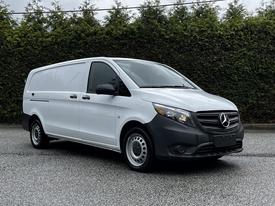 A 2023 Mercedes-Benz Metris van in white with a black front bumper and steel wheels parked facing left