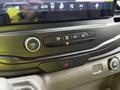 Dashboard controls of a 2023 Ford Transit showing climate settings volume control and hazard light button