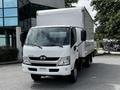 A 2018 Hino 195 box truck with a white exterior facing forward and a clear cargo area visible behind the cab