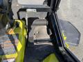 Close-up of the control area of a 2010 Kubota F3990 featuring foot pedals and control panels