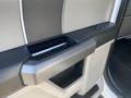 Interior door handle of a 2017 Ford F-150 with a textured design and a sleek, modern finish
