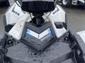 A 2017 Polaris Scrambler with a sleek design featuring a black and white body and a prominent 850 emblem on the front