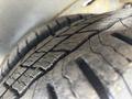 Close-up of a worn tire from a 2018 Chevrolet Express showing tread patterns and signs of use