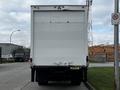 A back view of a 2006 Hino 268 truck with a white cargo box and no visible markings