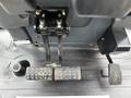 Close-up of the foot pedals and control levers inside a 2011 John Deere 310SJ 4x4 Wheel Loader Extended Hoe 4 in 1