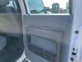 The image shows the interior door panel of a 2015 Ford F-450 SD featuring a storage pocket and a handle