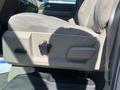 A close-up view of the adjustable seat control on the driver's side of a 2013 Ford Expedition