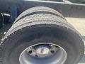 Close-up of a tire mounted on a rim showing deep tread patterns with the brand name Yokohama visible on the sidewall