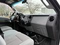 Interior view of a 2016 Ford F-550 Super Duty showing the dashboard seats and controls in a spacious cab design