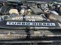 Close-up of a black engine cover labeled Power Stroke V8 Turbo Diesel on a 2008 Ford F-450 SD