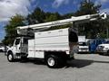 A 2012 Freightliner M2 106 with a Terex aerial lift mounted on the back featuring a white exterior and multiple compartments for storage