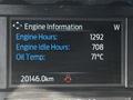 Display showing engine information with readings for engine hours, idle hours, and oil temperature in a 2021 Ford F-550