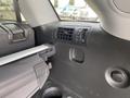 Interior view of a 2015 Kia Sorento showing air vents center console and storage compartments