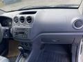 Interior view of a 2013 Ford Transit Connect dashboard showing the control panel air vents audio system and gear shift