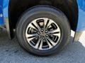 A close-up of a wheel and tire from a 2021 Chevrolet Colorado showing a shiny alloy rim and a tire labeled Valera HT