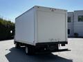 A white 2007 GMC W3500 box truck with a rear loading ramp and a blank cargo area