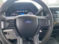 Steering wheel of a 2017 Ford F-250 SD featuring the Ford logo and dashboard with various instrument displays and controls