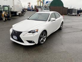 A 2015 Lexus IS in white with a sleek design featuring a prominent front grille and sporty wheels
