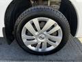 A close-up of a silver alloy wheel from a 2017 Nissan NV200 featuring a Continental tire with visible tread pattern