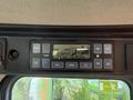 Control panel of a 2018 Doosan DL300-5 featuring temperature settings display and adjustable controls for fan and mode