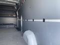 2024 Mercedes-Benz Sprinter cargo van interior showing a spacious empty cargo area with gray walls and floor without any additional equipment or features