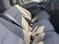 Interior of a 2017 Ford F-150 showing two gray cloth front seats with seat belts and a simple dashboard design
