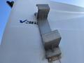Close-up of a metal bracket mounted on the side of a 2014 Ford F-350 SD designed for secure attachment or support