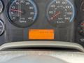 Dashboard of a 2011 International 4300 showing gauges for RPM speed fuel and hours clock with an illuminated display reading ENG PTO HRS 499.1