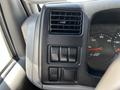 Interior dashboard of a 2009 Ford LCF 550 showing air vents and control switches next to the speedometer and RPM gauge