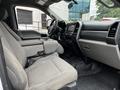 Interior view of a 2020 Ford F-350 SD showing front seats and dashboard with a center console and modern controls