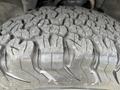 Close-up of a rugged tire tread on a 2016 Chevrolet Tahoe showing deep grooves and patterns designed for off-road traction