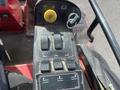 Control panel of a 2014 Toro Groundmaster 5910 featuring various switches knobs and a joystick for operation