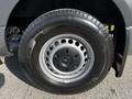A close-up of a tire on a 2021 Mercedes-Benz Sprinter featuring a silver rim and black tire tread pattern