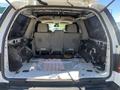Interior view of a 2013 Ford Expedition showing an empty cargo area with no seats and visible metal framework