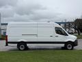 2019 Mercedes-Benz Sprinter van in white with a high roof and long cargo space viewed from the side