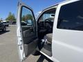 A 2012 Chevrolet Express with the driver's side door open showing the interior and steering wheel