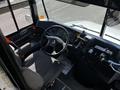 Interior view of a 2022 Blue Bird Vision bus showing the driver's seat steering wheel and dashboard controls