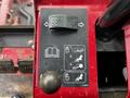 Control panel of a 2012 Toro Groundsmaster featuring buttons and levers for operational functions