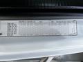A 2010 Freightliner M2 106 vehicle specification label displaying weight ratings and tire information for various axles