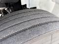 Close-up of a worn tire on a 2022 International MV607 showcasing visible tread wear and surface texture