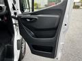 A 2020 Mercedes-Benz Sprinter van's front door interior panel featuring a sleek handle and storage compartment