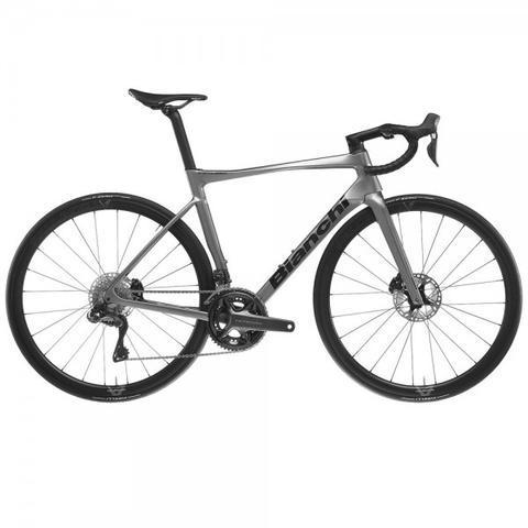 2024 Bianchi Specialissima Comp Ultegra Di2 12sp Road Bike with a sleek gray frame and aerodynamic design featuring disc brakes and high-performance components