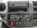 Dashboard controls of a 2014 Hino 195 featuring a Kenwood audio system climate controls and various buttons including an eco mode and air conditioning settings
