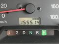 A close-up view of a vehicle's dashboard showing the odometer reading 155514 with gear shift indicators for L, 2, D, N, R, and P