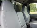 Interior view of a 2017 Ford F-750 showing two gray upholstered front seats with a textured surface