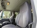 Interior of a 2011 International 4300 featuring two black fabric truck seats designed for driver and passenger comfort